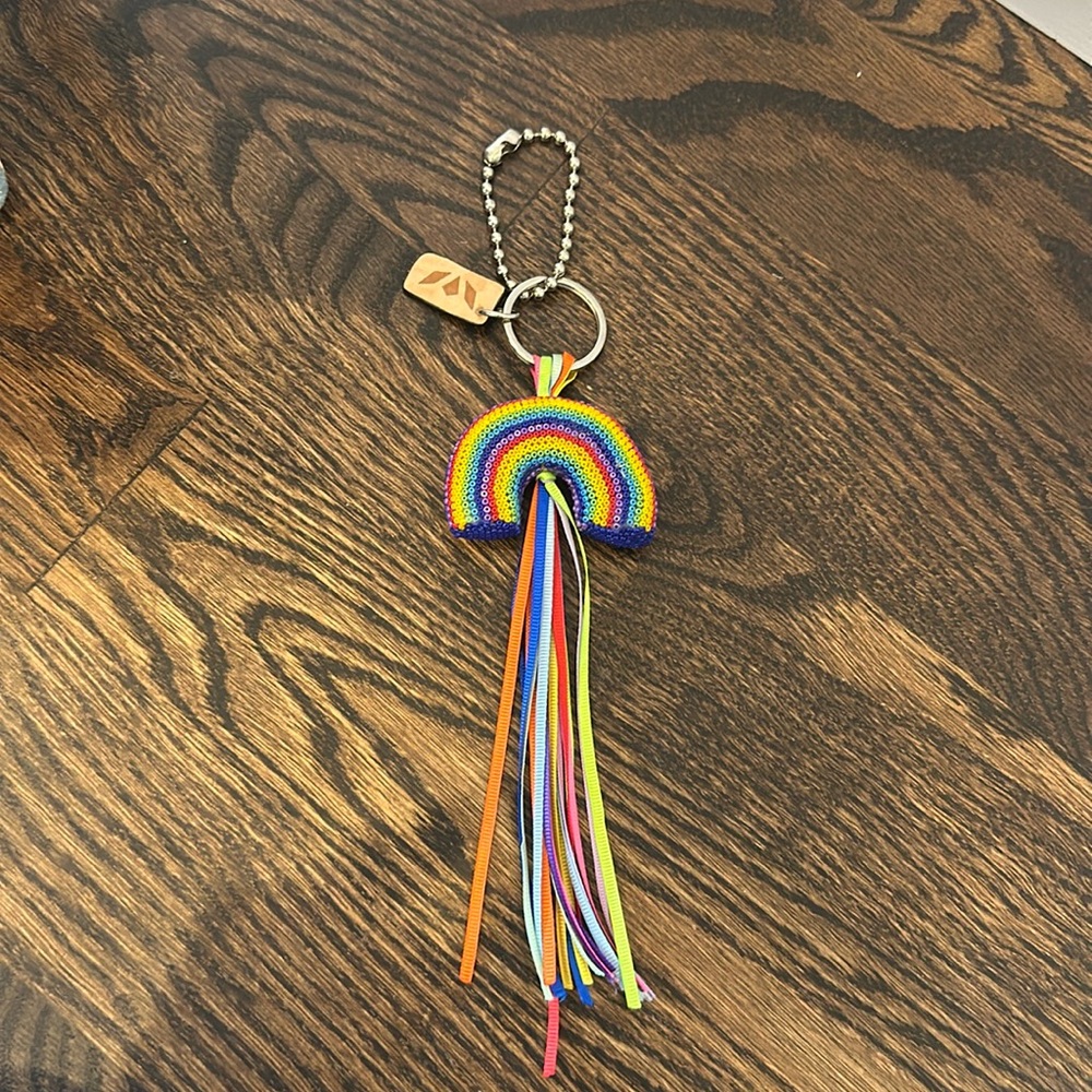 Consuela rainbow charm